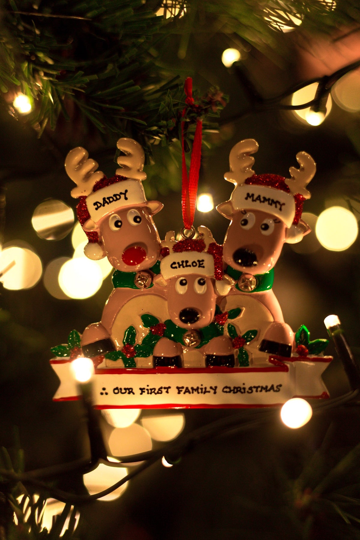 New Reindeer Family of 3 Personalised Christmas Decoration hanging on a Christmas tree
