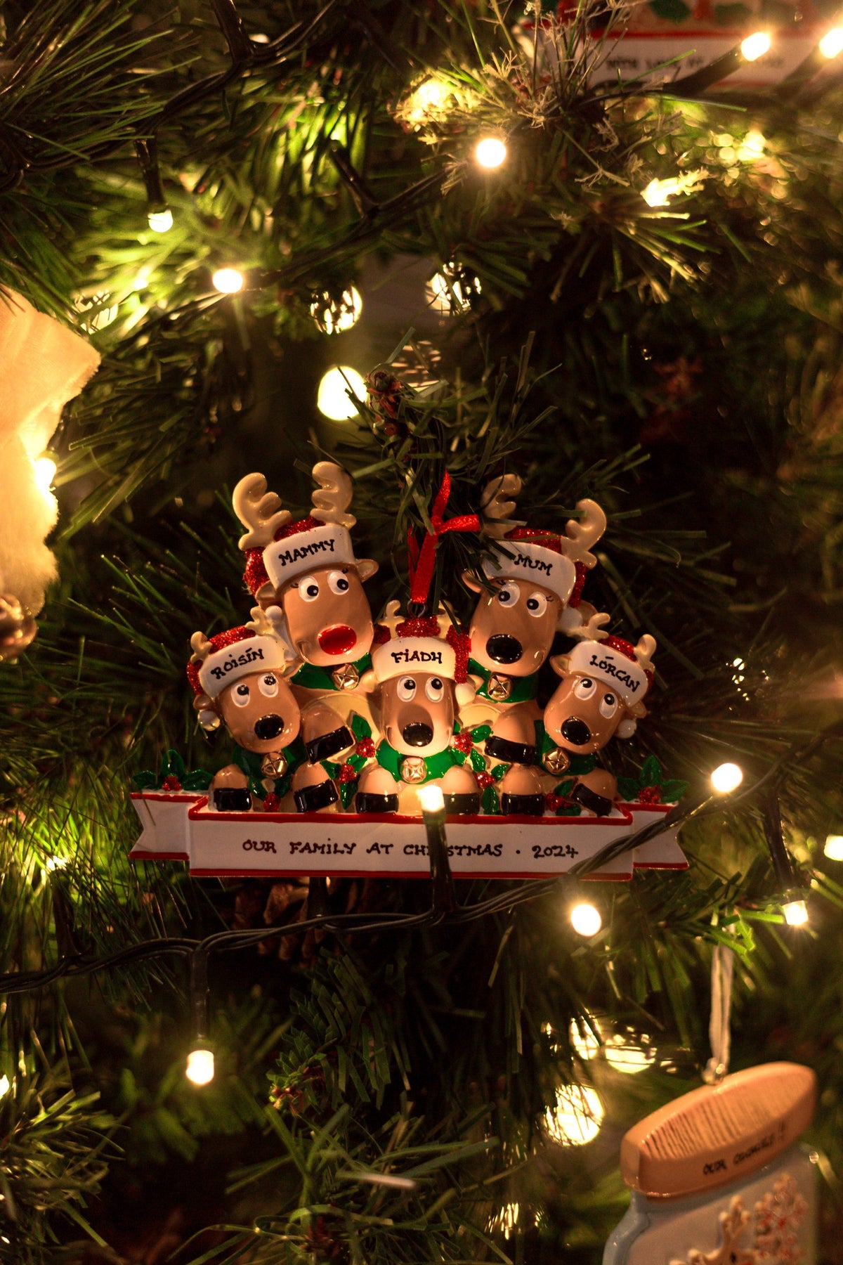 New Reindeer Family of 5 Personalised Christmas Decoration hanging on a Christmas tree