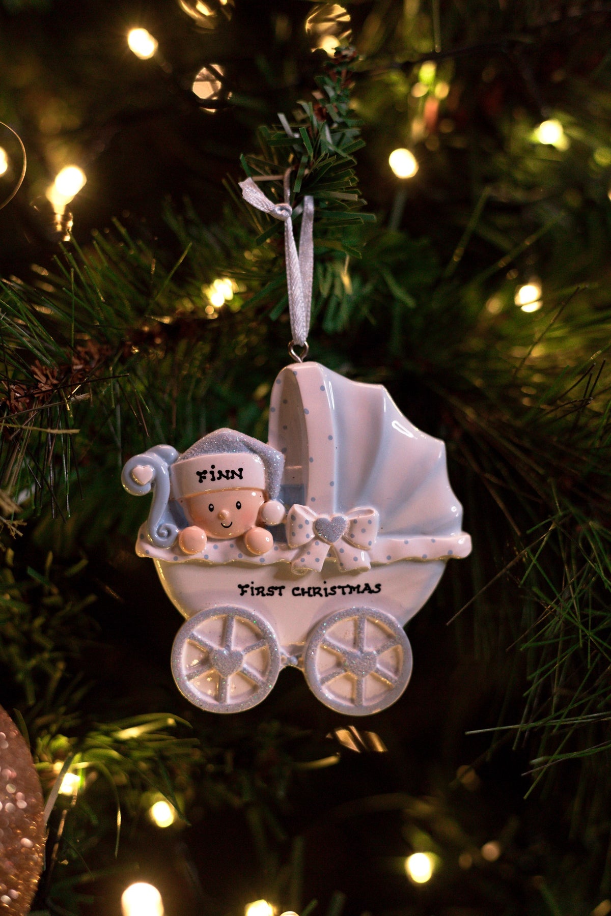 New Baby Carriage - Blue Personalised Christmas Decoration hanging on a Christmas tree