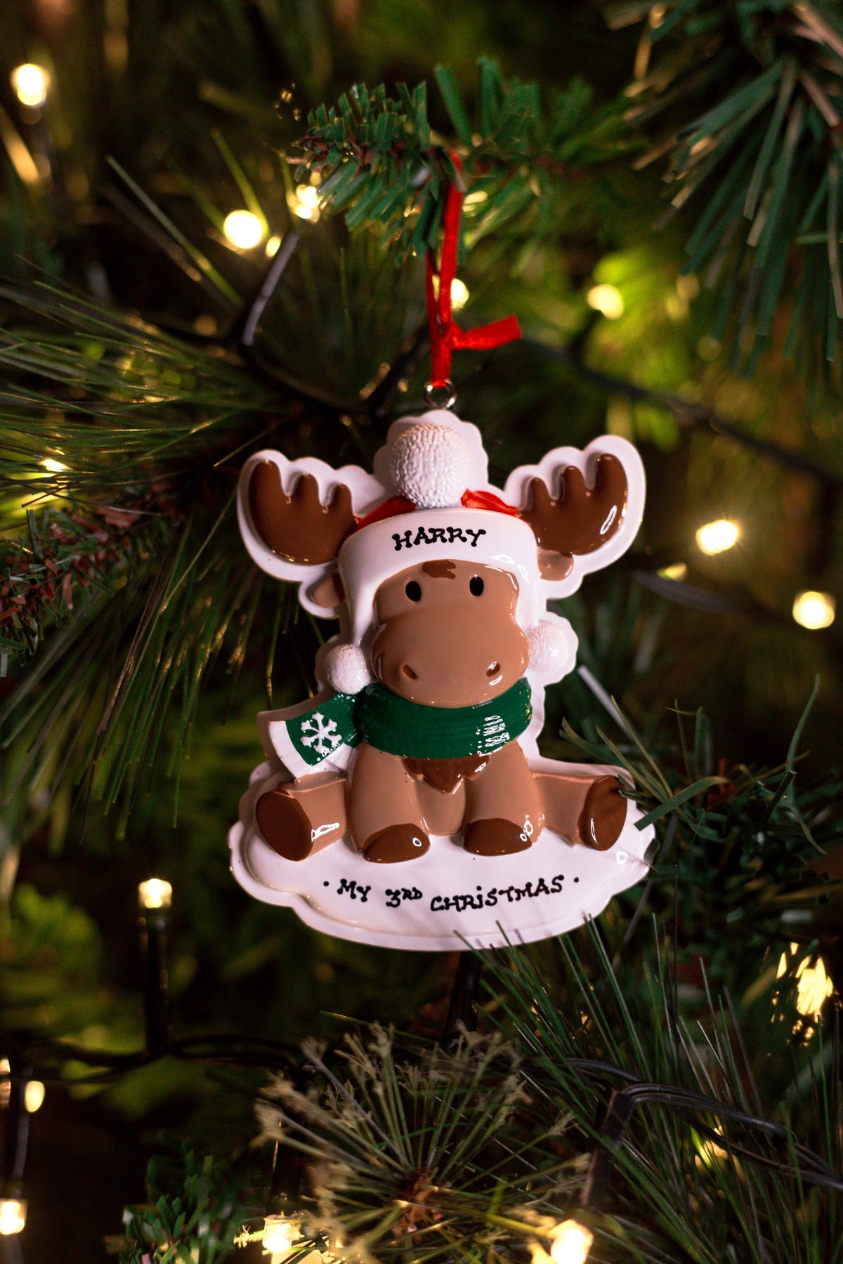 Moose Baby Personalised Christmas Decoration hanging on a Christmas tree