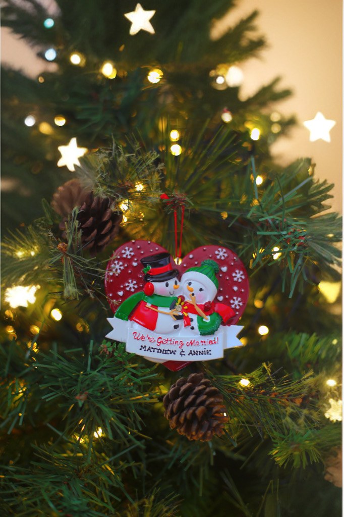 We are getting Married - Personalised Christmas Decoration hanging on a Christmas tree
