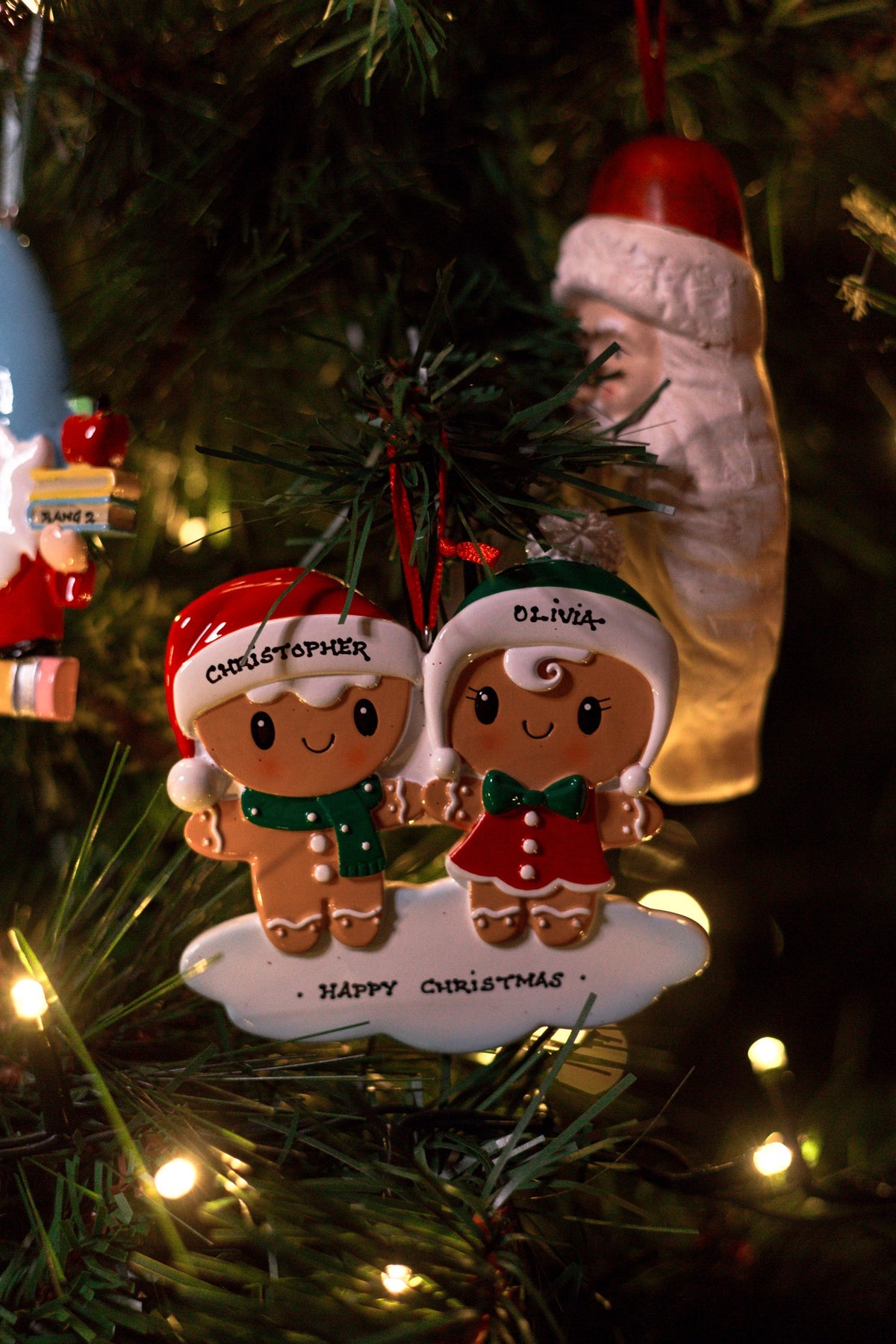 Gingerbread Couple Personalised Christmas Decoration hanging on a Christmas tree