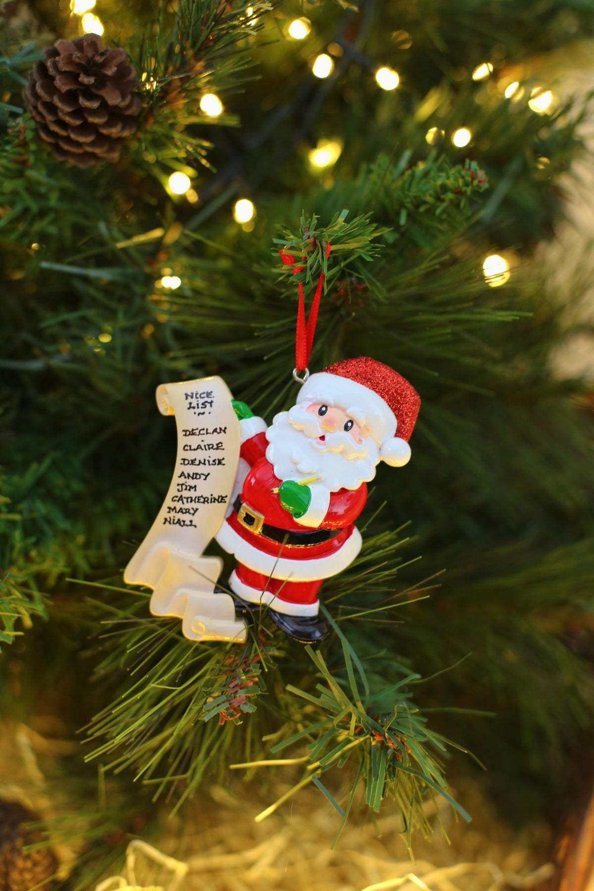 Santas List Personalised Christmas Decoration hanging on a Christmas tree