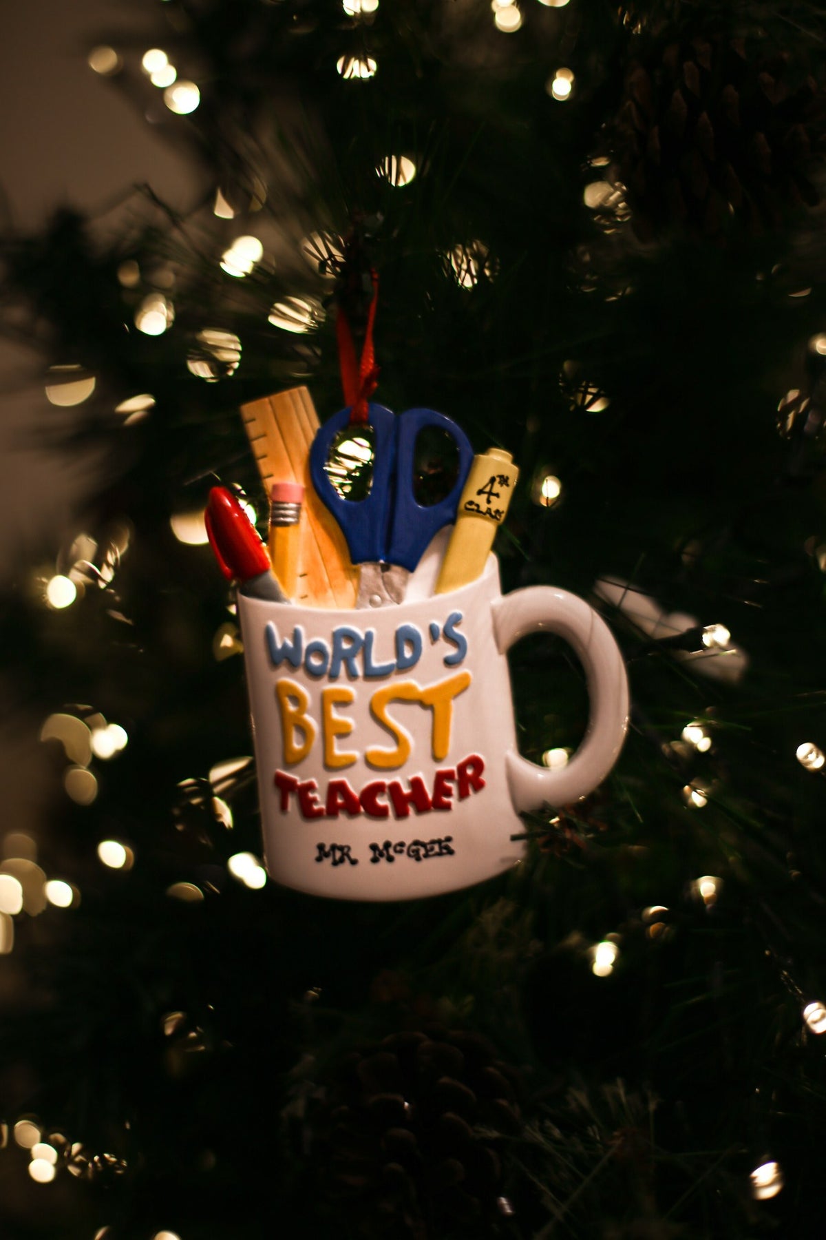 Best Teacher Mug Personalised Christmas Decoration hanging on a Christmas tree