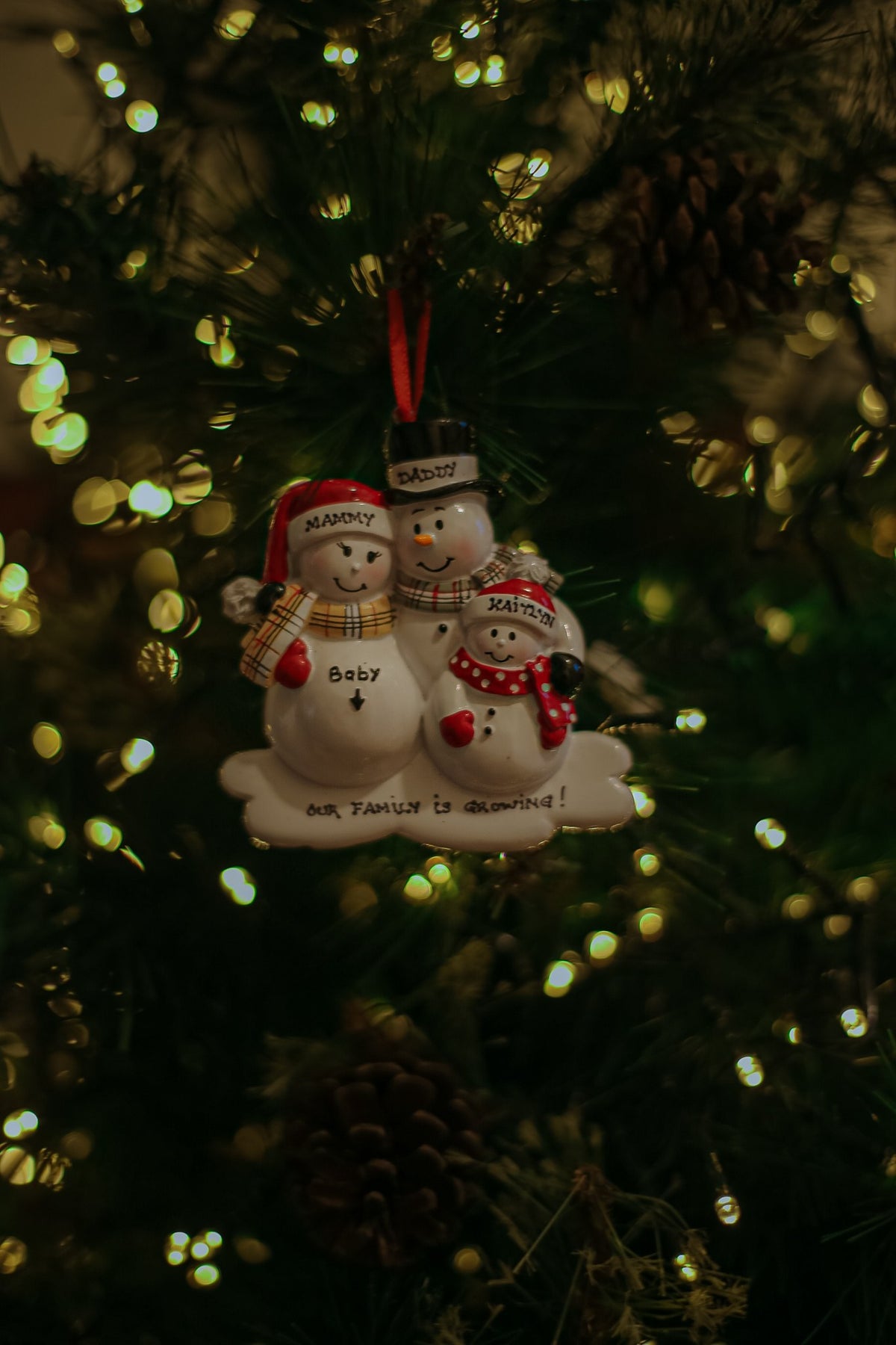 We Are Expecting with one child Personalised Christmas Decoration hanging on a Christmas tree