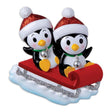 Penguin Family - Couple On Red Sled