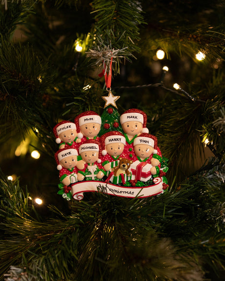 Opening Presents (Family of 7) Personalised Christmas Decoration hanging on a Christmas tree