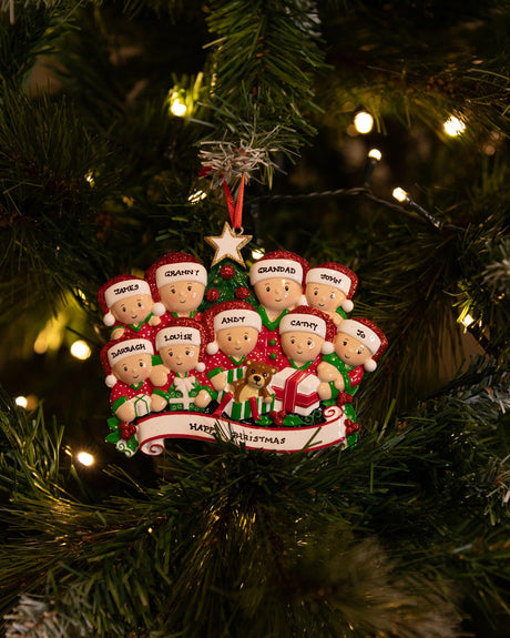 Opening Presents (Family of 9) Personalised Christmas Decoration hanging on a Christmas tree