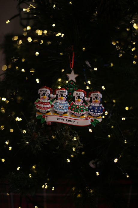 Cute Sweater Family of 4 Personalised Christmas Ornament hanging on a Christmas tree