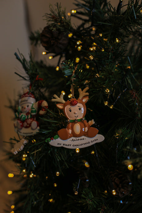 Baby in Reindeer Suit Personalised Christmas Decoration hanging on a Christmas tree