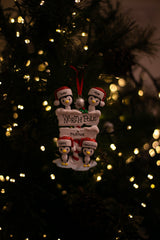 North Pole Penguin Family x 4 hanging on a Christmas tree