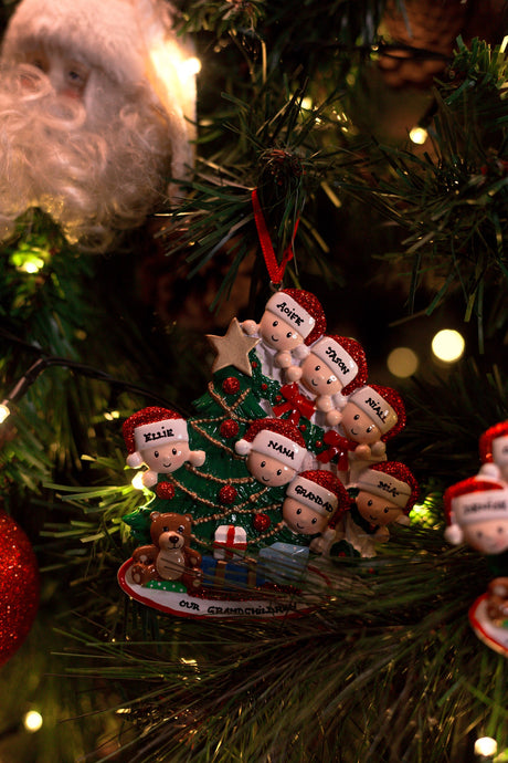 Family Peeking over the Bannisters for a family of 7 Personalised Christmas Decoration hanging on a Christmas tree