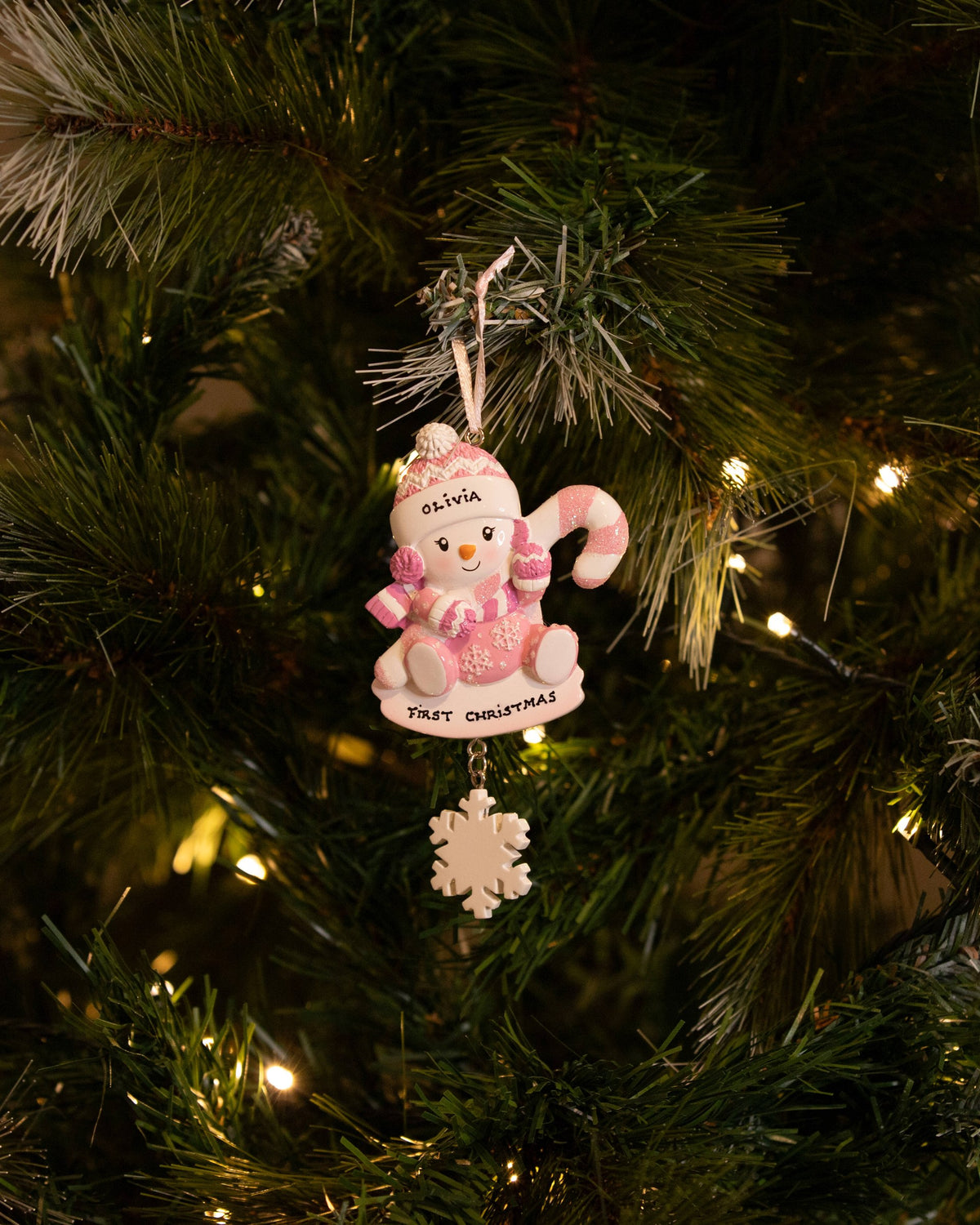 Snowbaby with Candy Cane (Pink) Personalised Christmas Decoration hanging on a Christmas tree