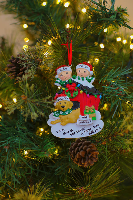 Family of 2 with their Dog Personalised Christmas Decoration hanging on a Christmas tree