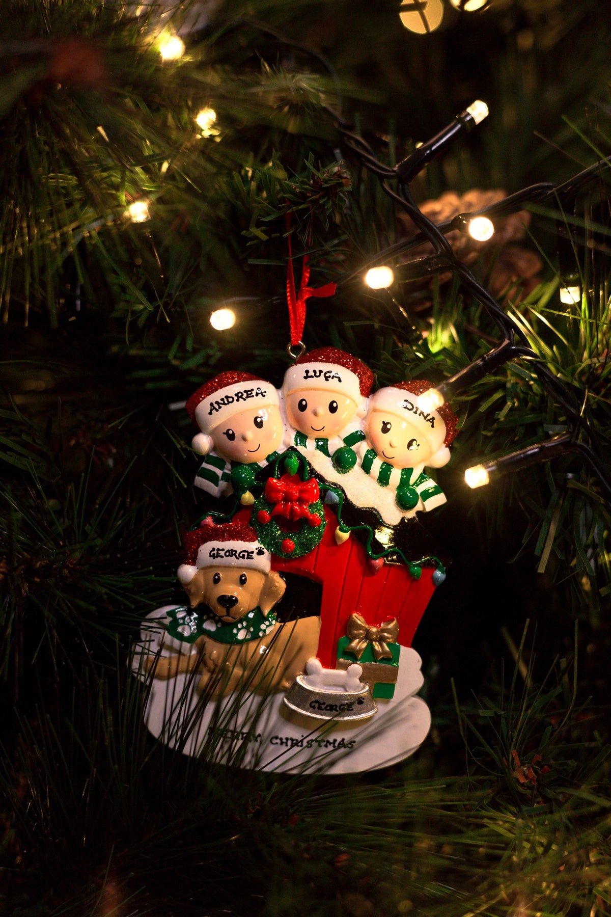Family of 3 with their Dog Personalised Christmas Decoration hanging on a Christmas tree