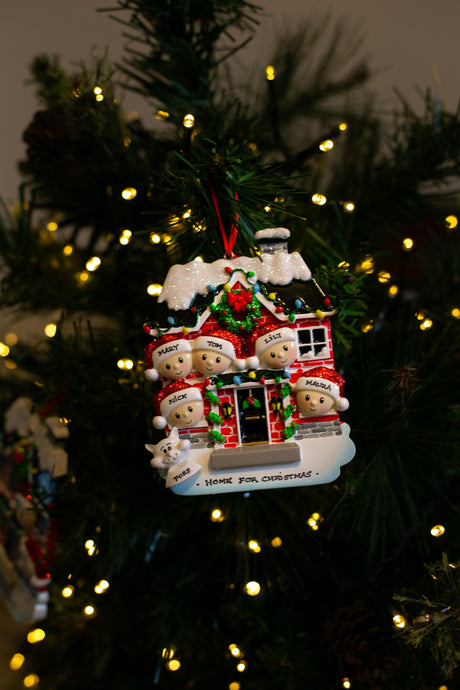 Red Brick House Family for 5 hanging on a Christmas tree