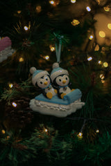 Twin Boy and Girl on a sled Personalised Christmas Decoration hanging on a Christmas tree