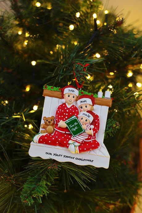Family Reading in a bed x 3 Personalised Christmas Decoration hanging on a Christmas tree