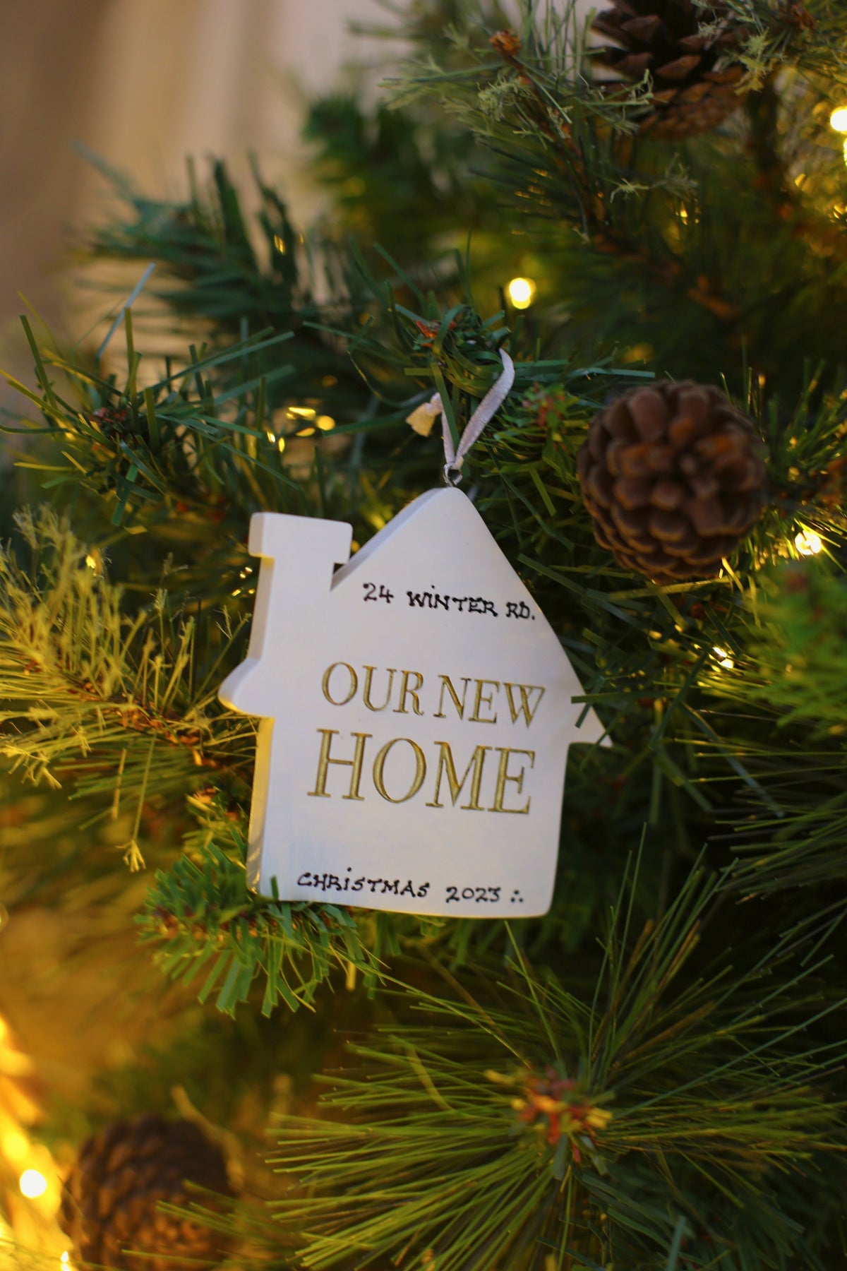 Our New Home - Personalised Christmas Decoration hanging on a Christmas tree