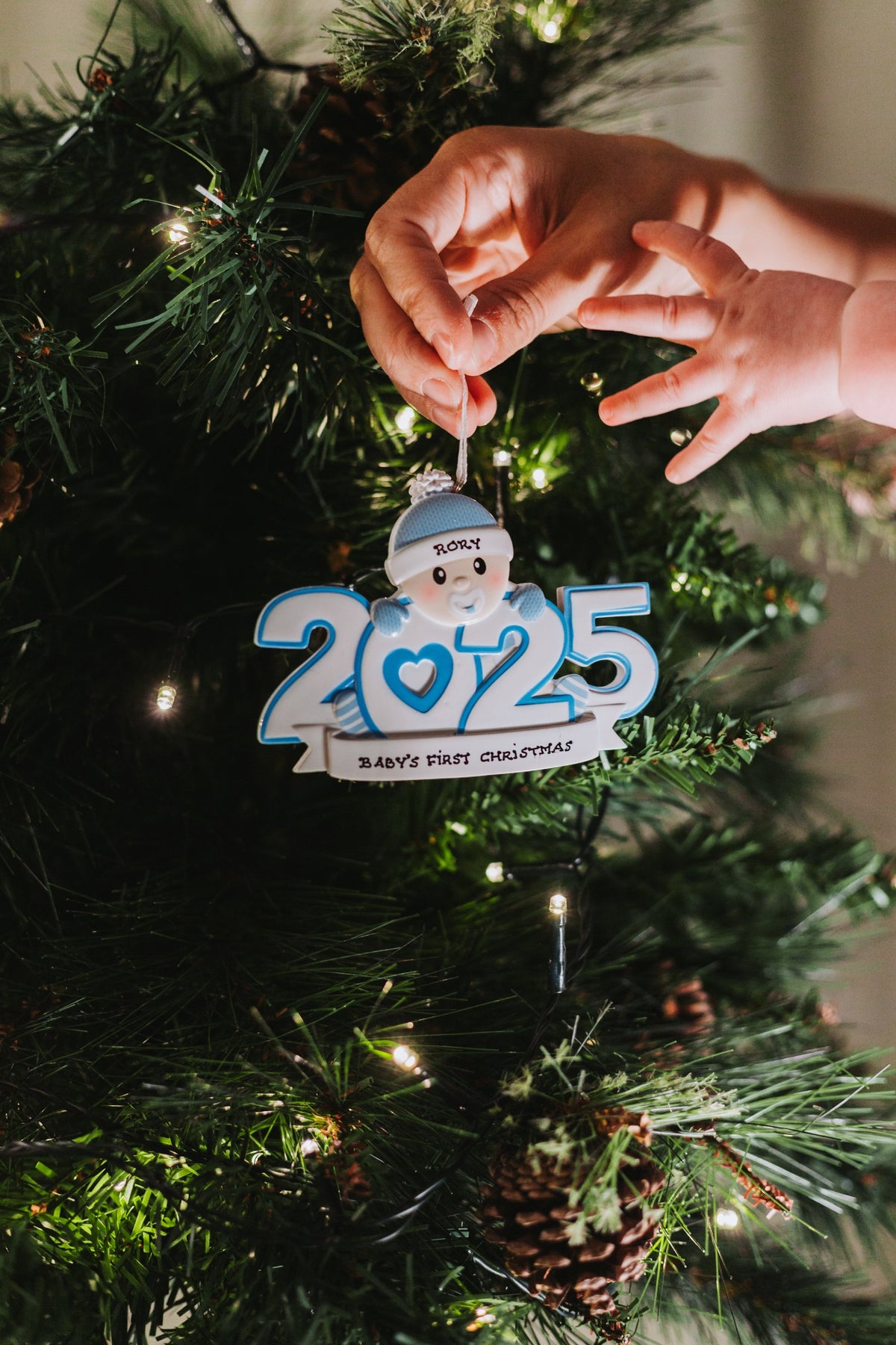 Baby Boy 2025 Personalised Christmas Decoration hanging on a Christmas tree