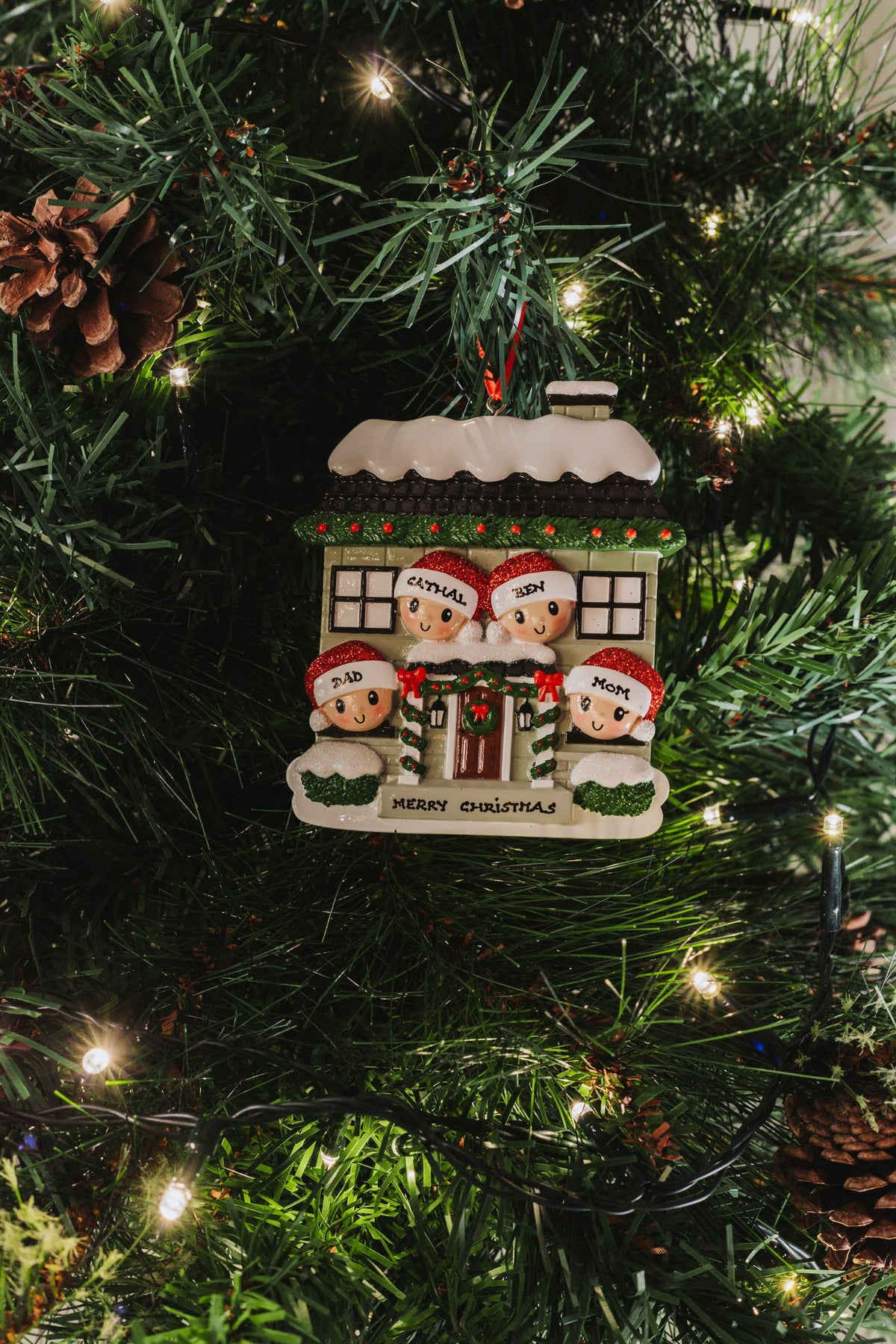 New House Family of 4 Personalised Christmas Decoration hanging on a Christmas tree