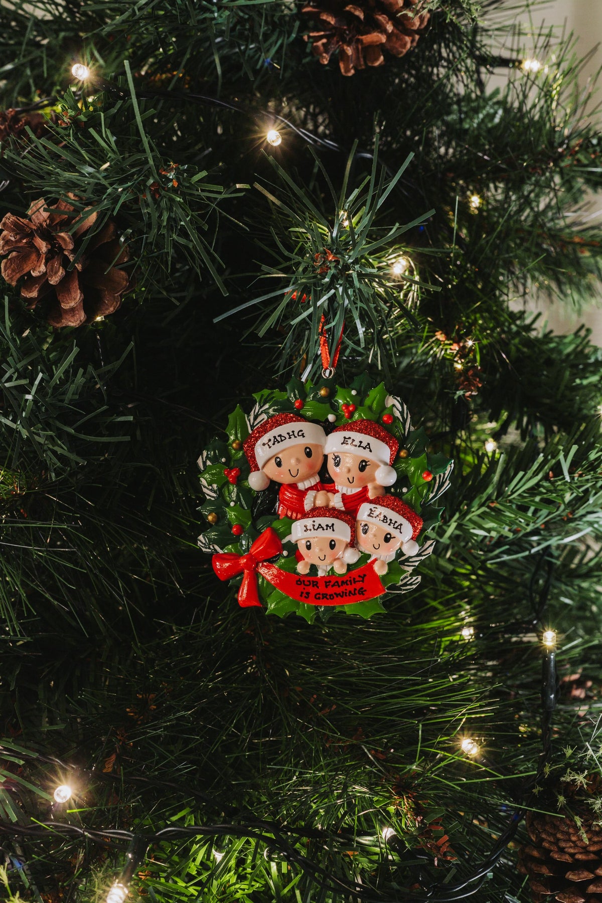 Wreath Family x 4 hanging on a Christmas tree