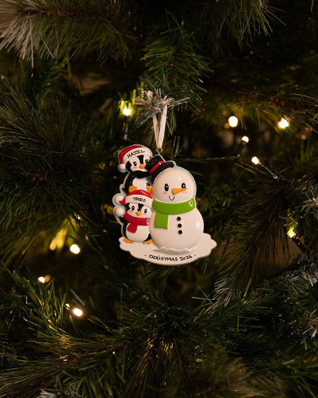 Family Building a Snowman (Family of 2) Personalised Christmas Decoration hanging on a Christmas tree