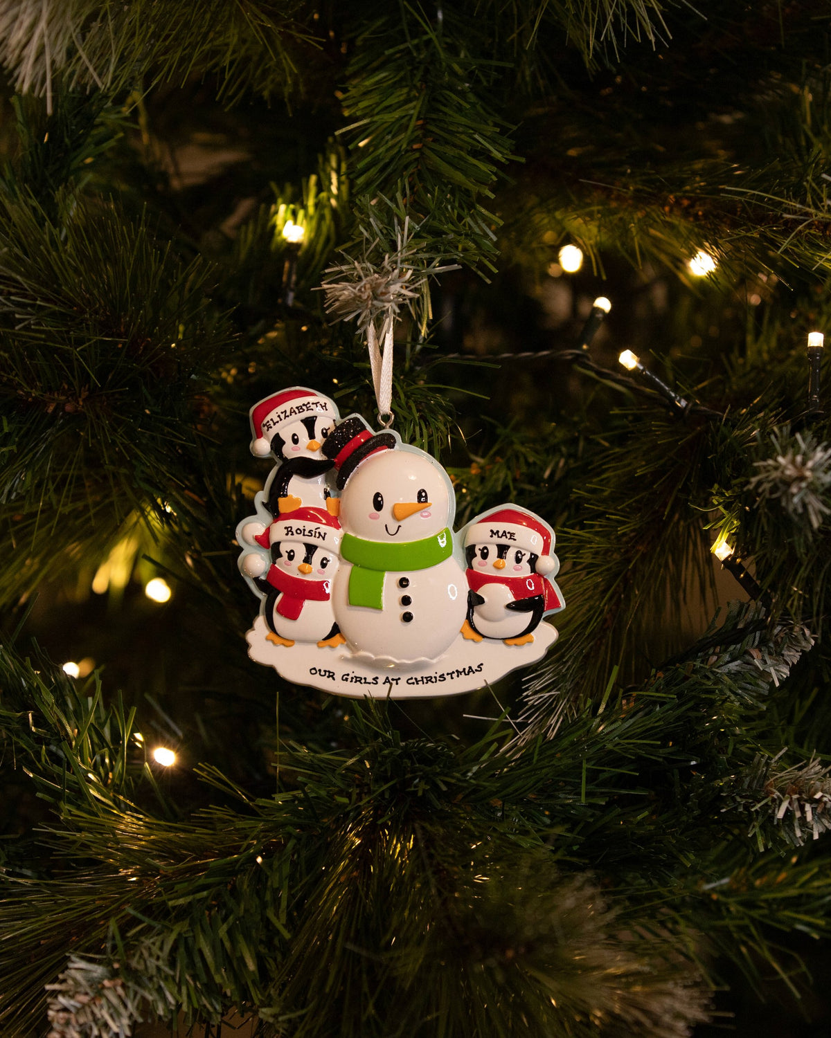 Family Building a Snowman (Family of 3) Personalised Christmas Decoration hanging on a Christmas tree