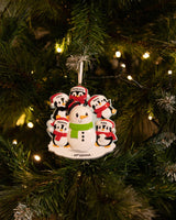 Family Building a Snowman (Family of 5) Personalised Christmas Decoration hanging on a Christmas tree