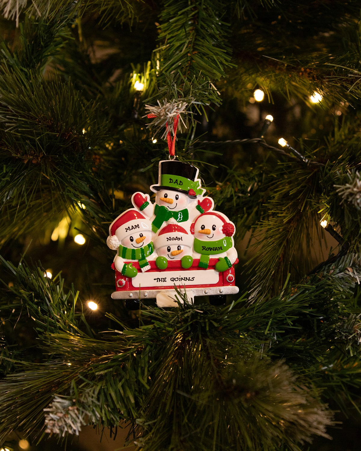 Back of Red Truck (Family of 4) Personalised Christmas Decoration hanging on a Christmas tree