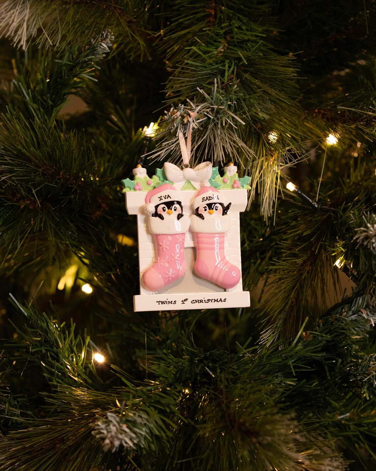 Twin Penguins in Stockings (Pink & Pink) Personalised Christmas Decoration hanging on a Christmas tree
