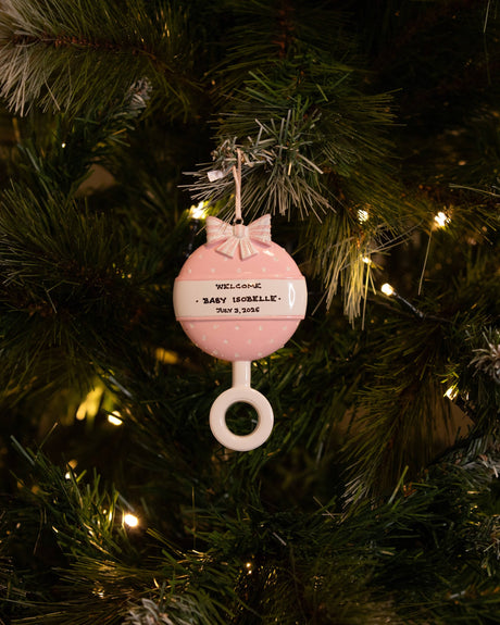 Pink Baby Rattle Personalised Christmas Ornament hanging on a Christmas tree