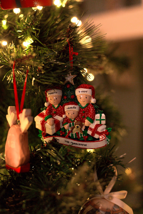 Opening Presents (family of 3) Personalised Christmas Ornament hanging on a Christmas tree