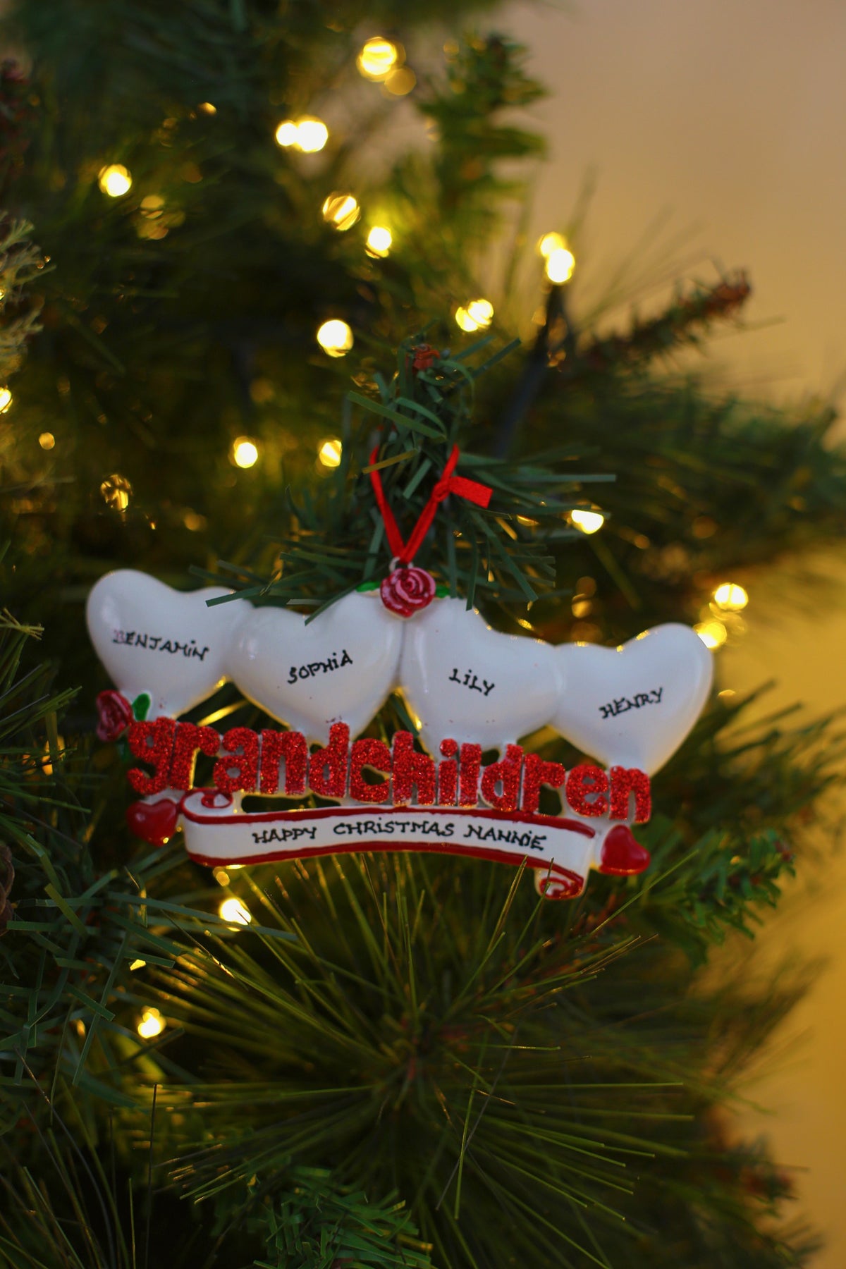 Grandchildren Hearts x 4 Personalised Christmas Decoration hanging on a Christmas tree