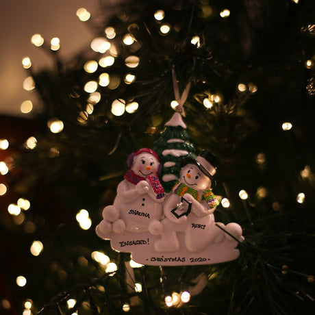 Snowmen Engagement Personalised Christmas Decoration hanging on a Christmas tree